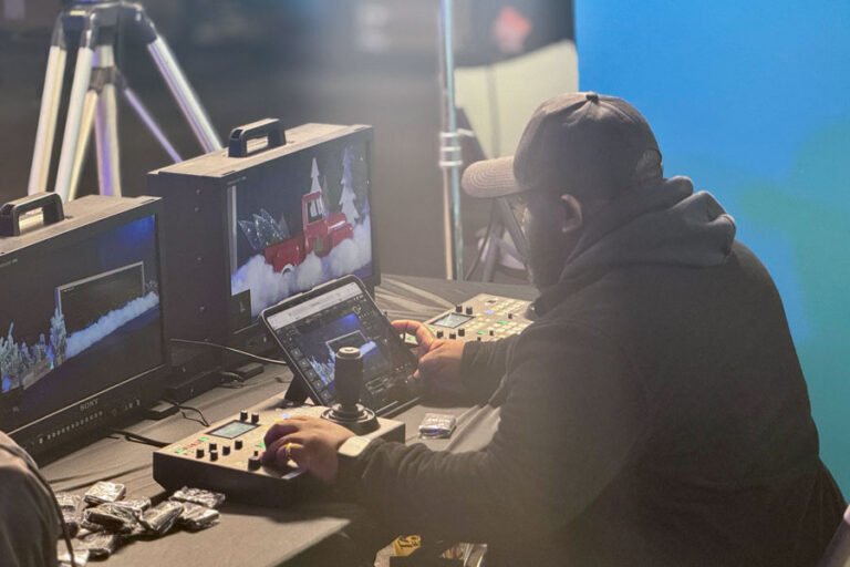 Person sitting a broadcast control station